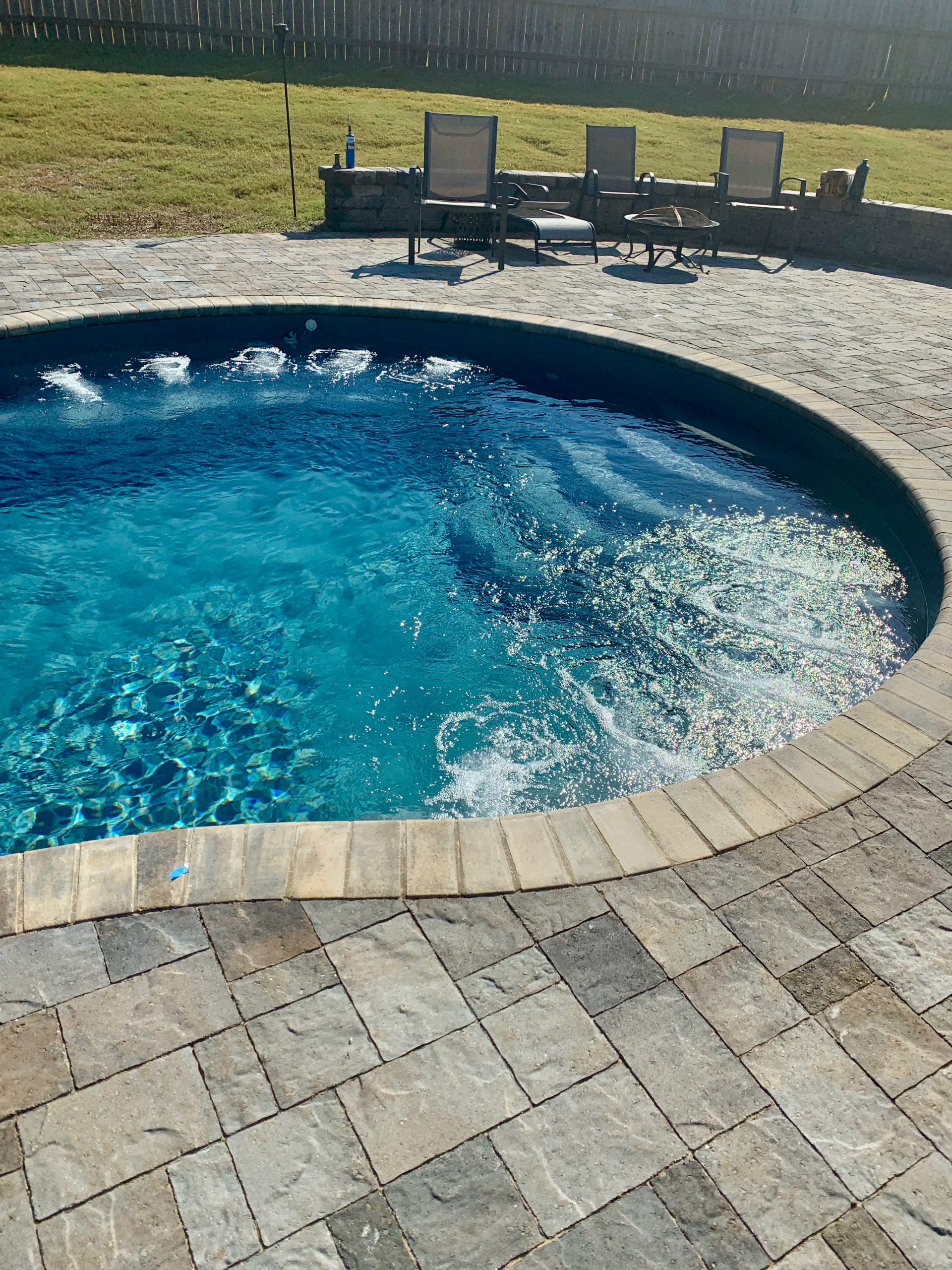 Crystal clear pool water surface with technical lighting