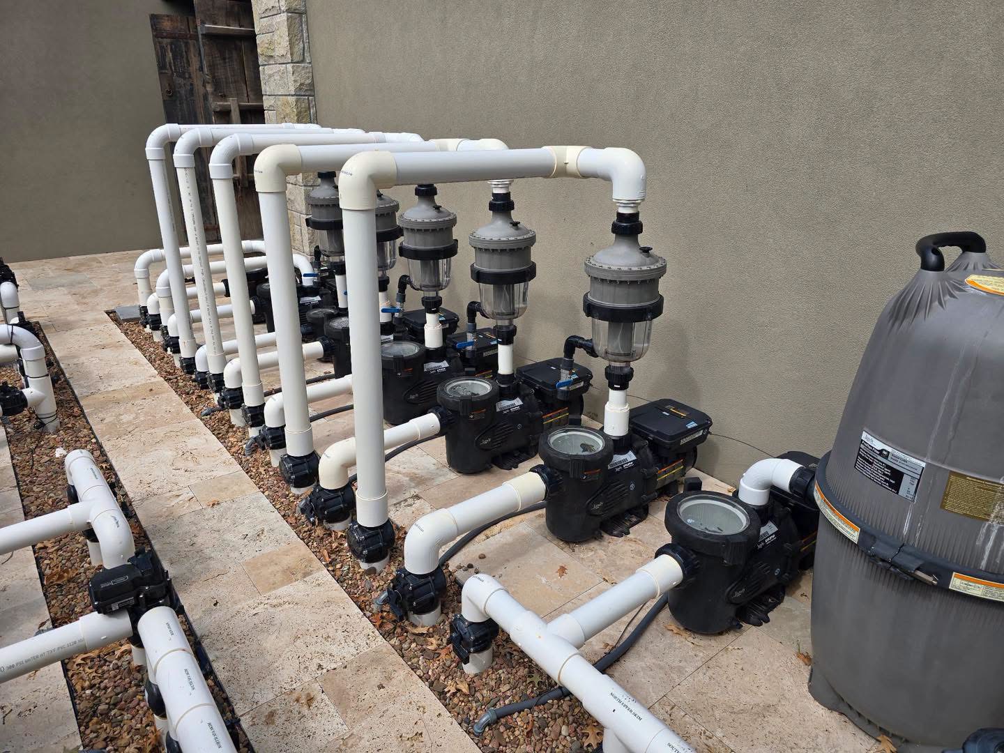 Structural pool piping and manifold work in progress on a Rocket City Water Wizards job site