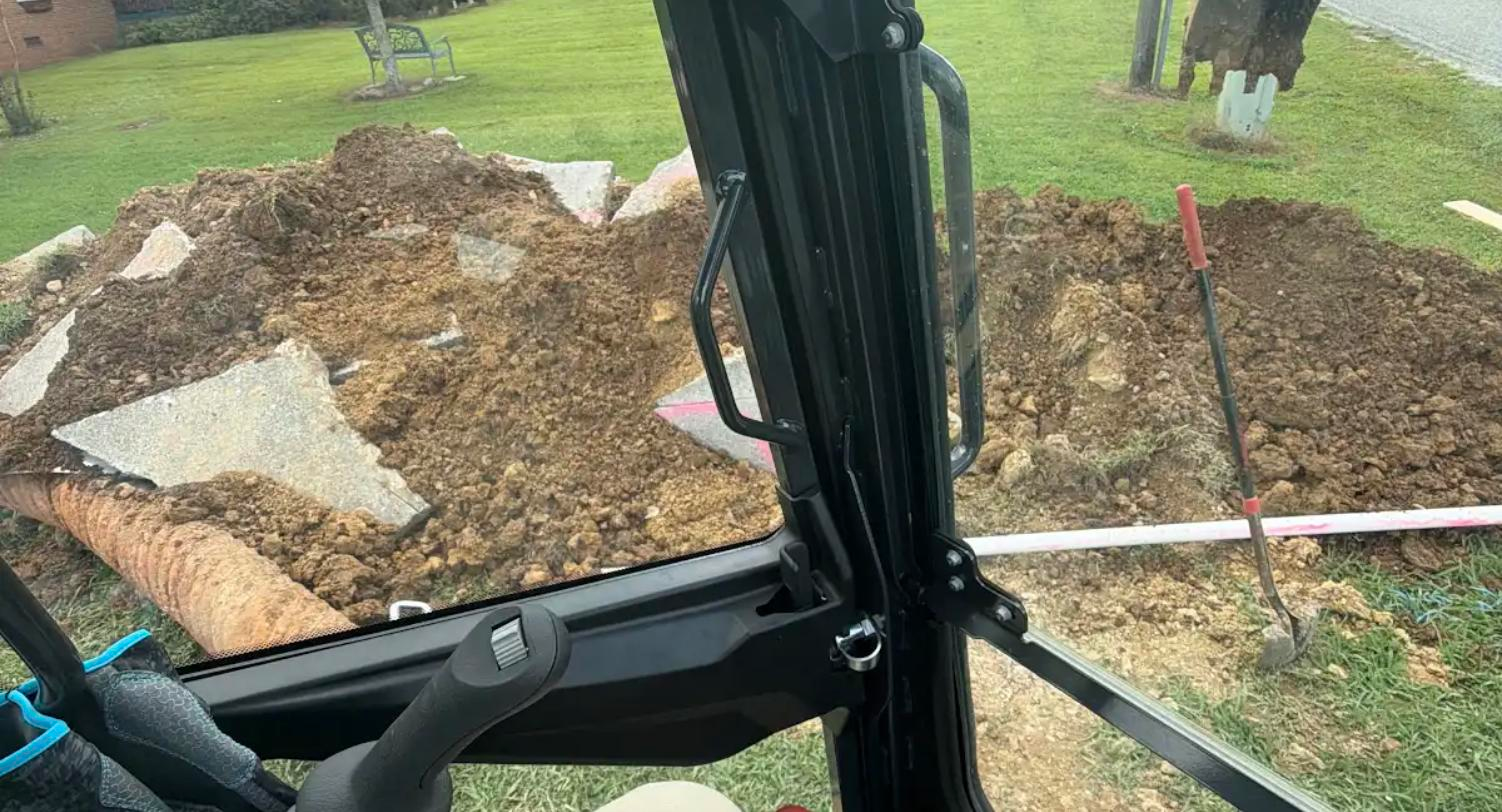 Careful excavation with marked utility locates during a pool line leak repair